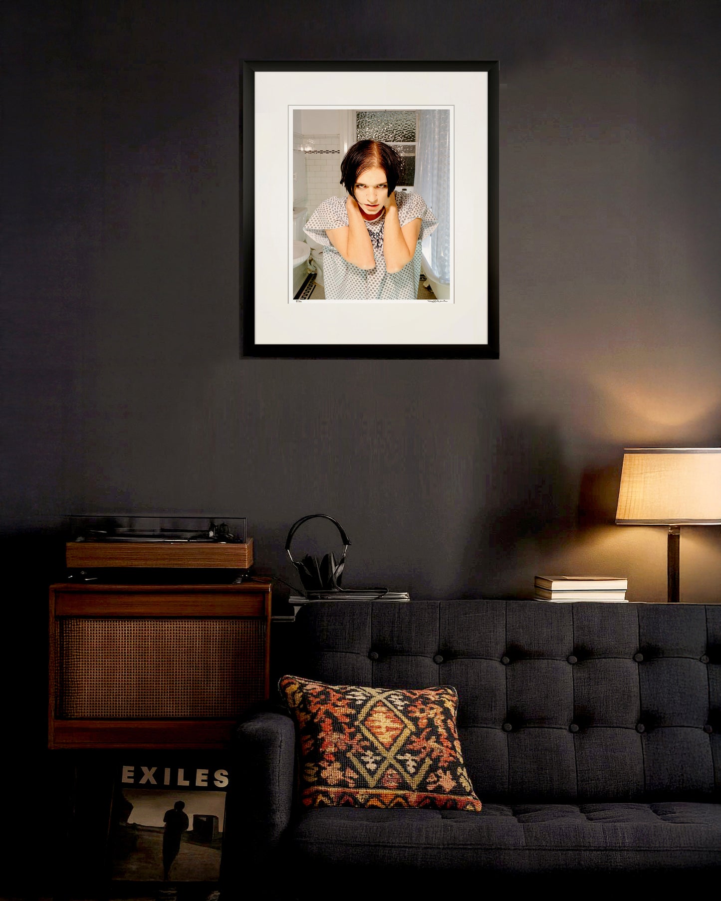 Collector Edition framed portrait of Brian Molko by Robin Sellick, displayed in a dark modern interior with turntable, books, and ambient light – evoking a moody, musical atmosphere.