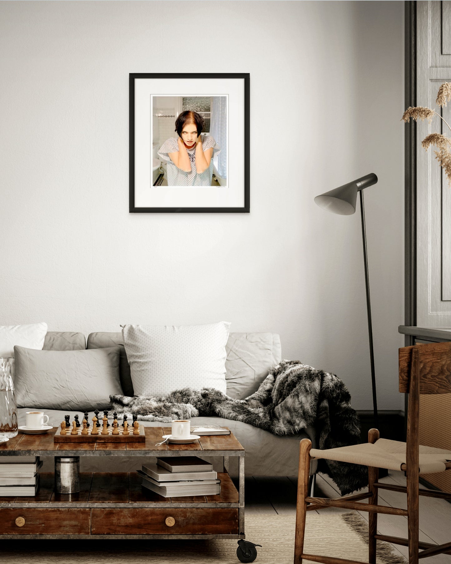 Collector Edition framed photographic portrait of Brian Molko by Robin Sellick, displayed in a sophisticated living room with warm natural textures and soft grey tones.