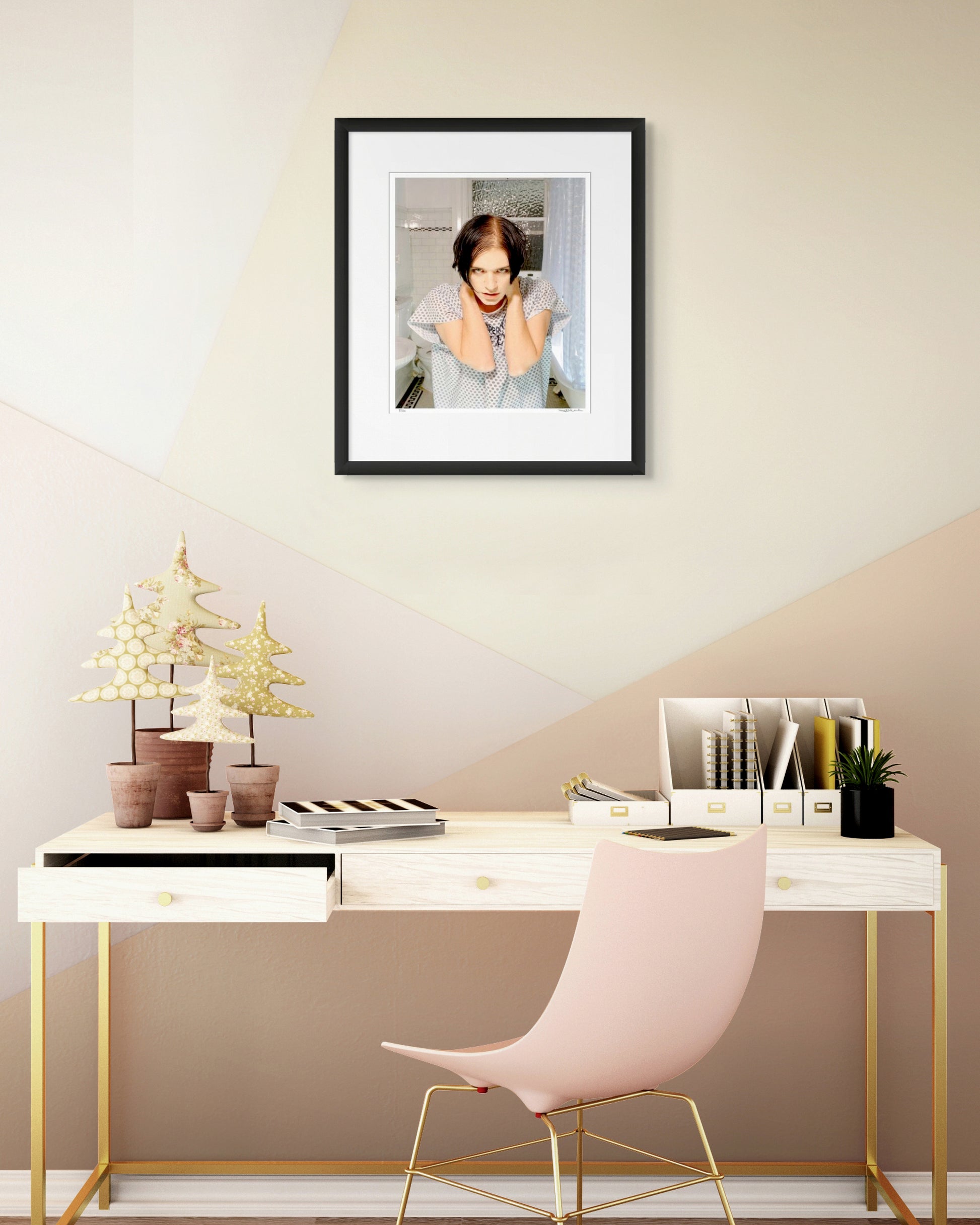 Collector Edition framed photographic portrait of Brian Molko by Robin Sellick, displayed above a light modern desk with gold detailing and pastel accents.