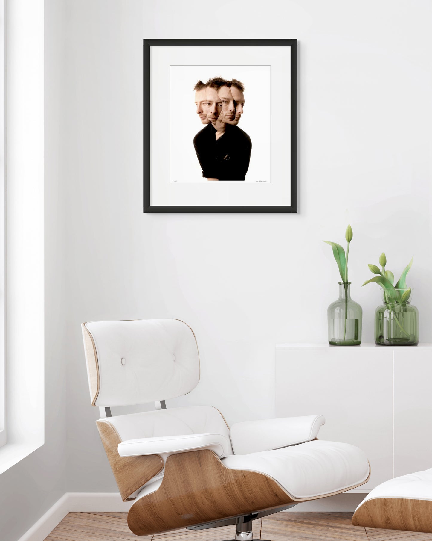 Collector Edition photographic portrait of Thom Yorke by Robin Sellick, presented in a bright modernist interior with white Eames chair and soft natural light.