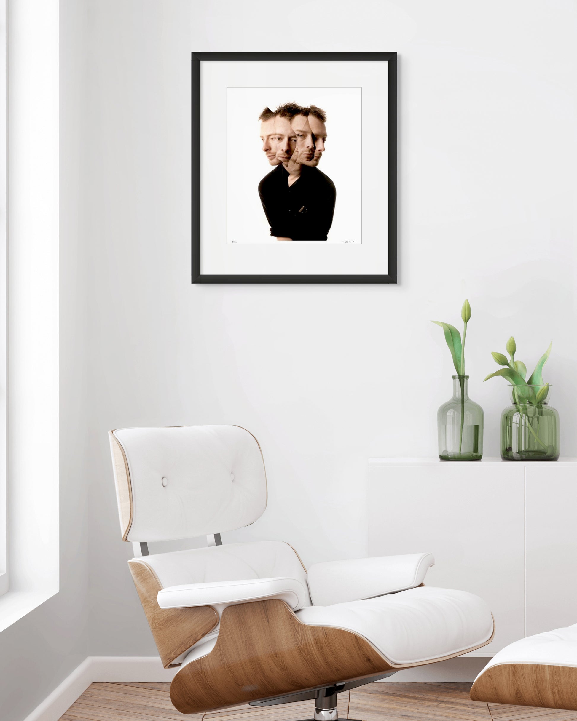 Collector Edition photographic portrait of Thom Yorke by Robin Sellick, presented in a bright modernist interior with white Eames chair and soft natural light.