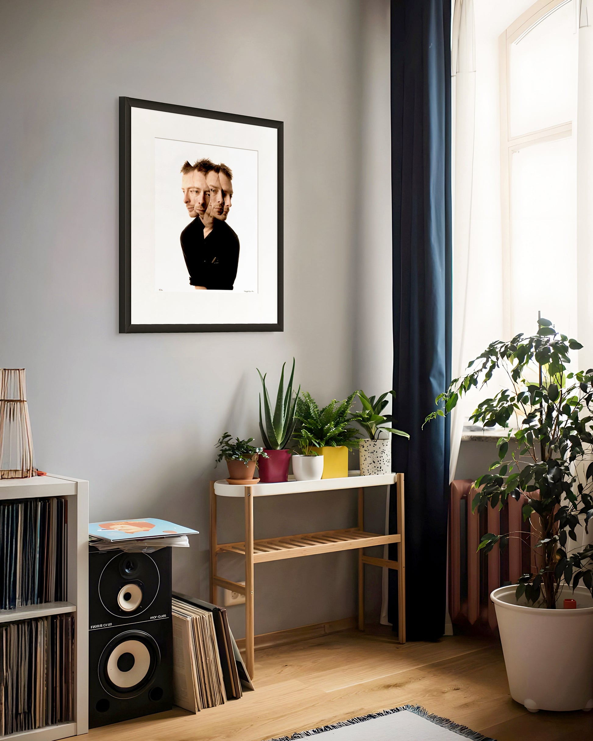Collector Edition framed portrait of Thom Yorke by Robin Sellick, displayed in a music room with vinyl records and natural light – evoking the creative spirit of the artist.