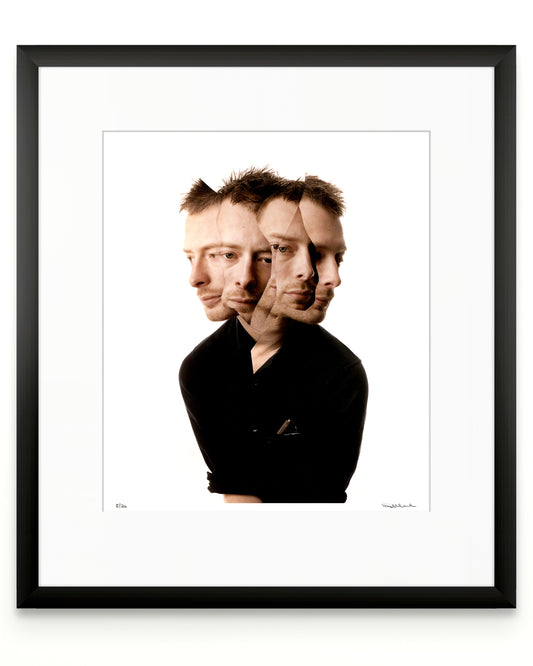 Framed photographic portrait of Thom Yorke by Robin Sellick, part of the Collector Edition series – a minimalist fine art print presented in a black frame with white mat.