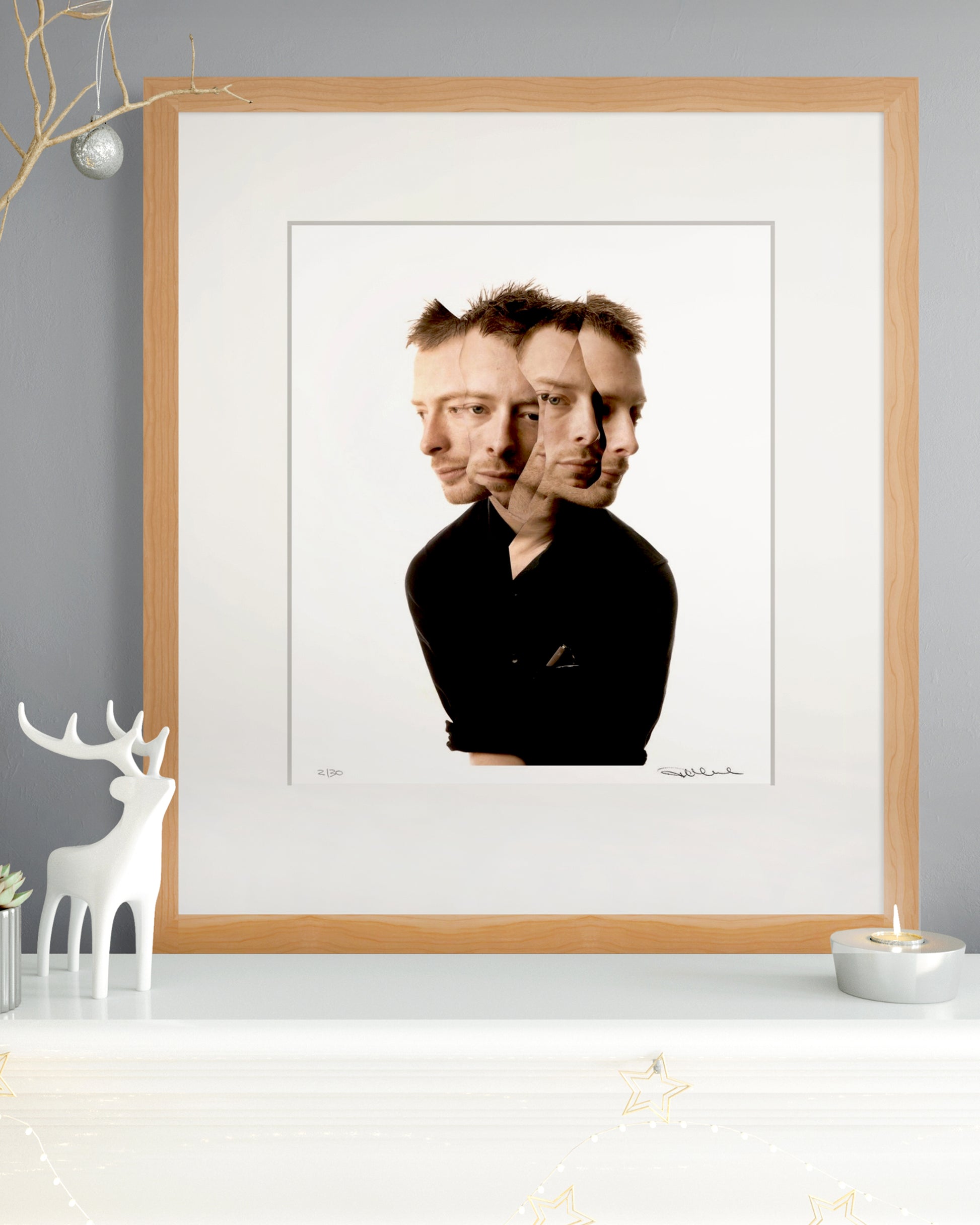 Framed limited edition Thom Yorke portrait by Robin Sellick with winter decor – a timeless collector’s gift from Radiohead’s OK Computer era.